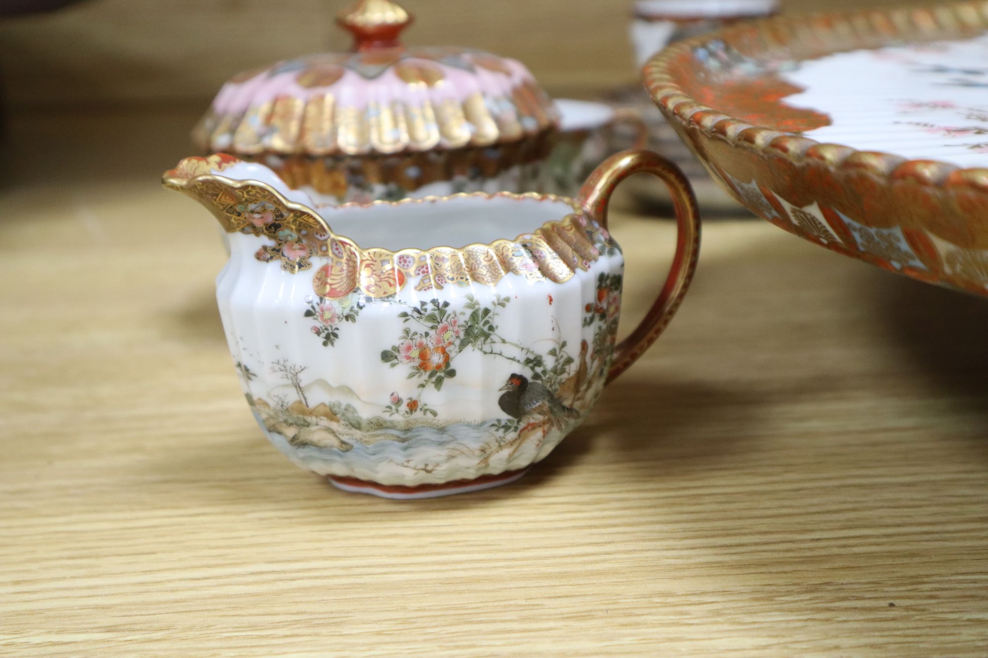 A Kutani part coffee service, with tazza tray base, largest diameter 45cm